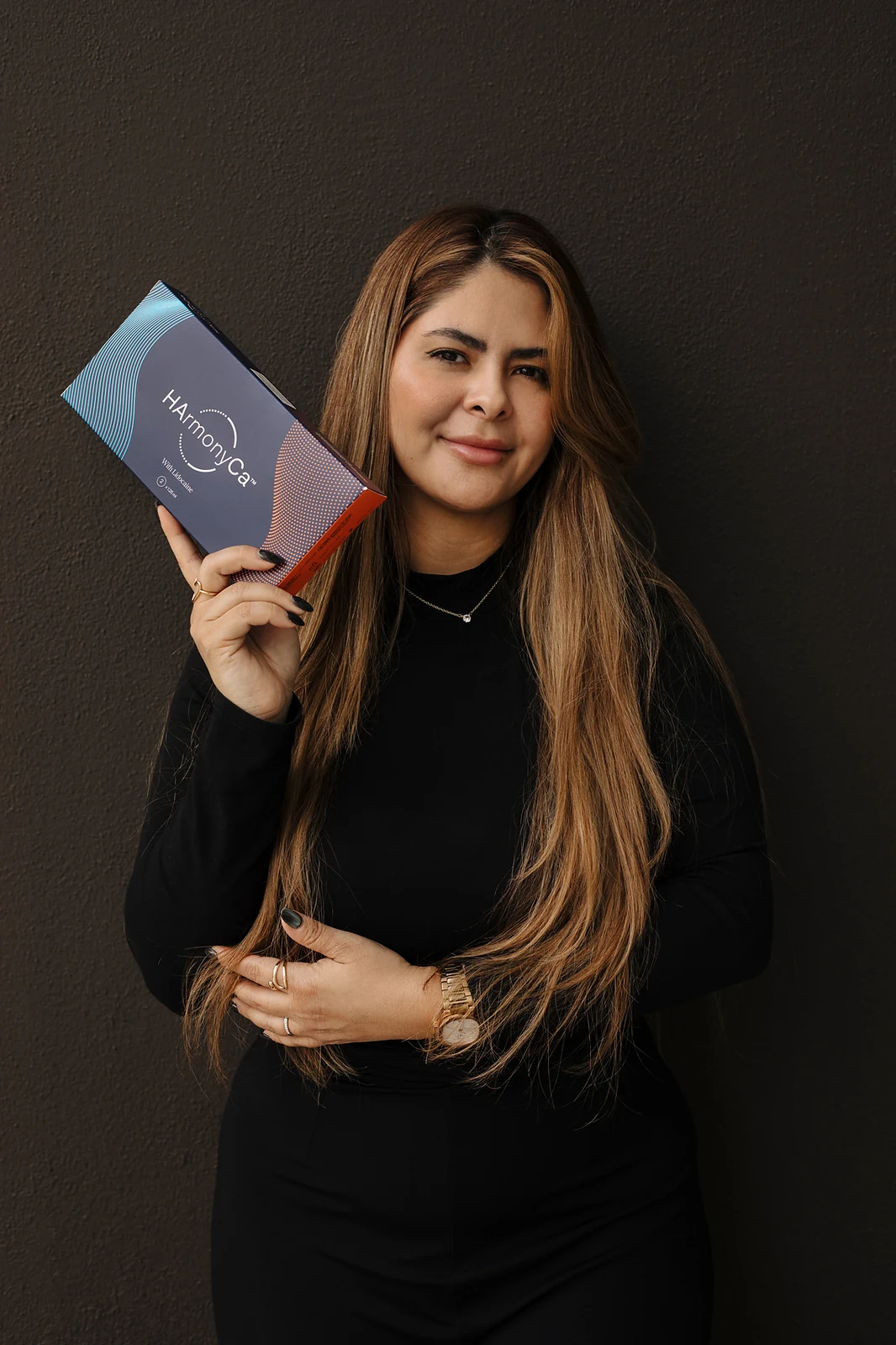 Dr. Sibaja with HArmonyCa, one of the biostimulators she works with